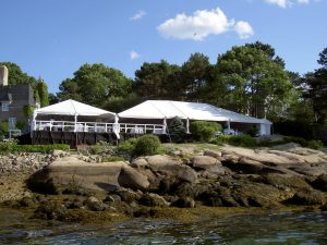 These tents have custom scaffolding/flooring that allowed the bride and groom to place their tent over the rocky cliff, quite literally ocean-side.